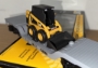 Picture of MTH RailKing Caterpillar Depressed Flatcar w/ Skid Loader (operated)